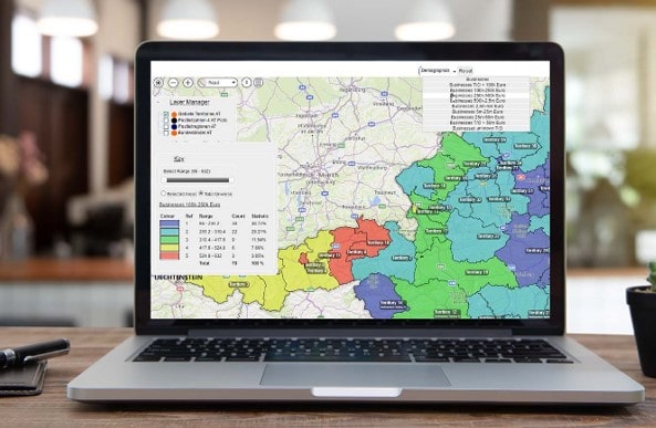 Laptop screen showing a map with various colour coded areas to show how businesses can maximise their sales potential with territory mapping software.